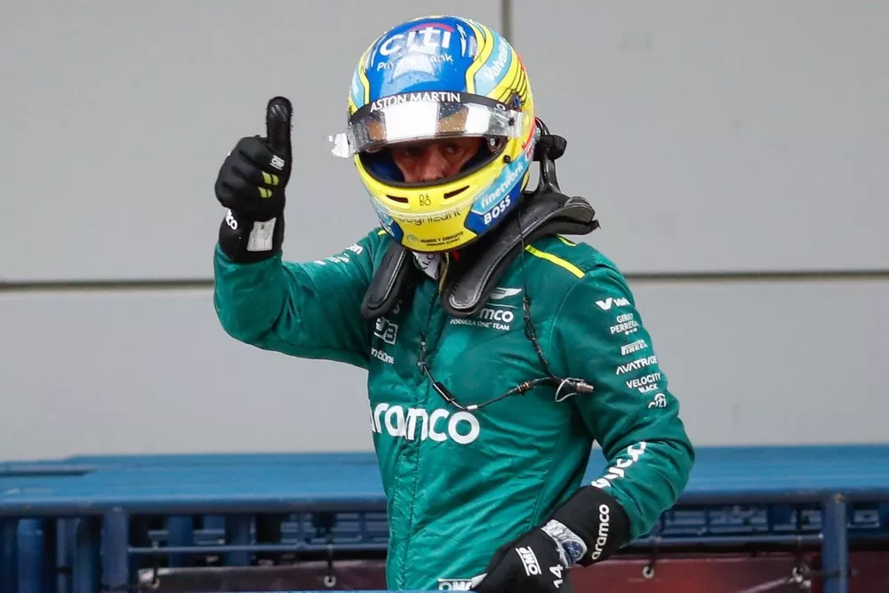 Fernando Alonso, Aston Martin F1 Team, waves at the crowds from Parc Ferme