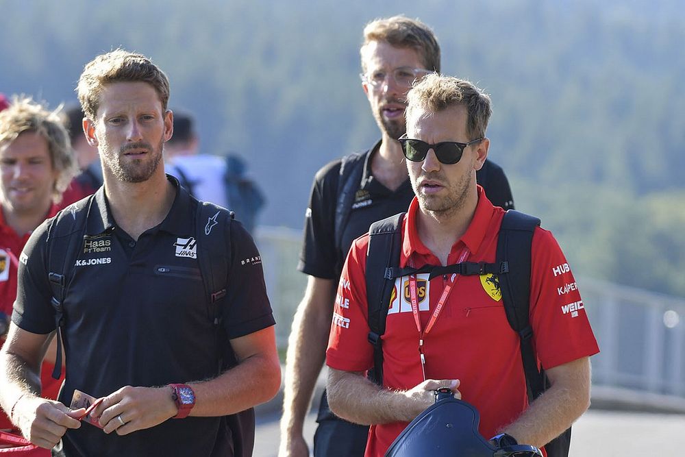 Romain Grosjean, Haas F1, and Sebastian Vettel, Ferrari
