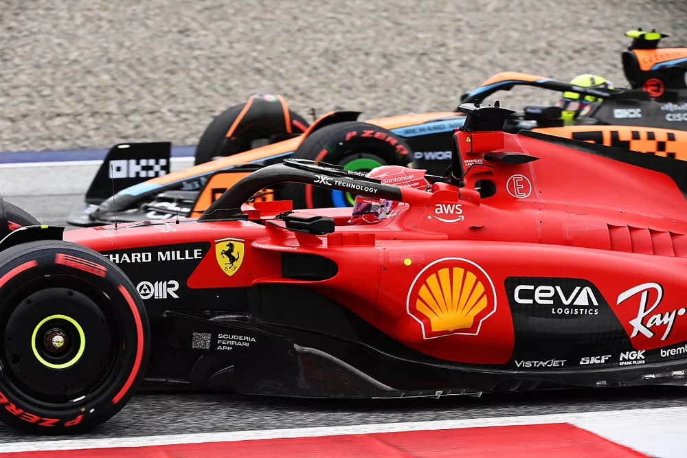 Charles Leclerc, Ferrari SF-23, passes Lando Norris, McLaren MCL60