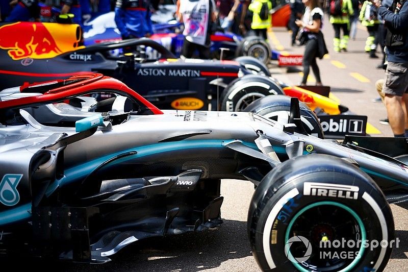 Cars of Valtteri Bottas, Mercedes AMG W10 and Pierre Gasly, Red Bull Racing RB15 lined up in the pit lane