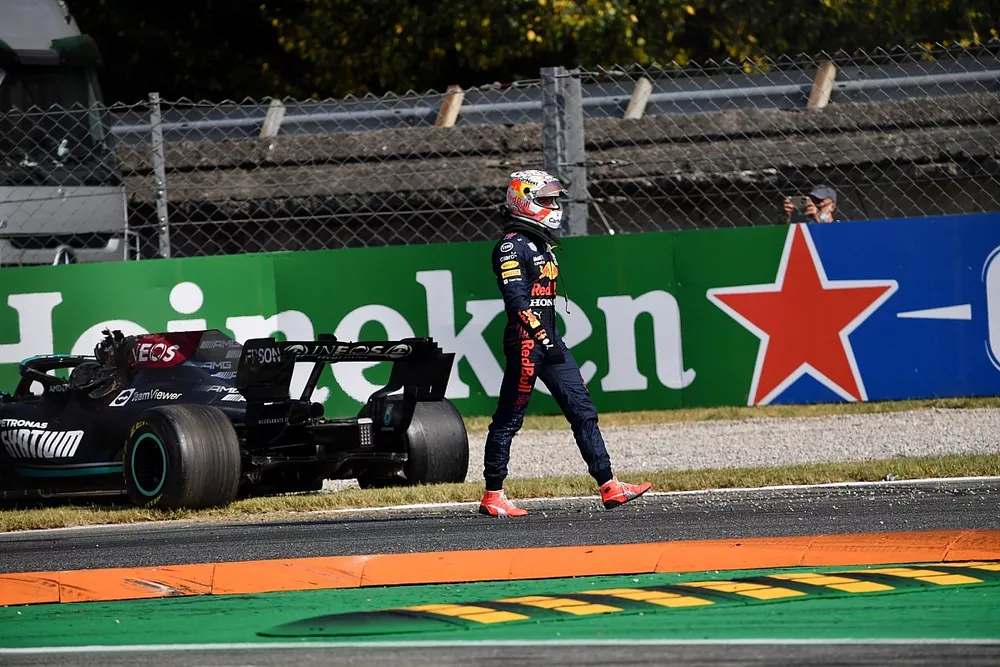 Max Verstappen, Red Bull Racing, walks away after colliding with Lewis Hamilton, Mercedes W12
