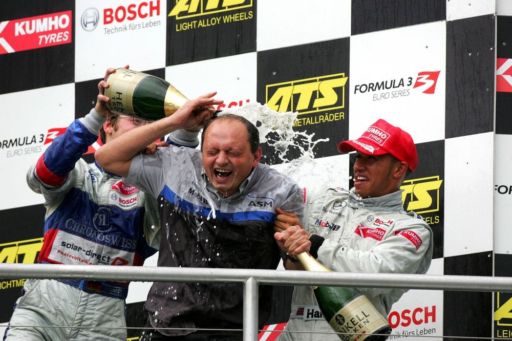 An ASM mechanic getting a champagne shower from Maximilian Gotz (GER), ASM Formule 3, Dallara F305 Mercedes (3rd, left) and Lewis Hamilton (GBR), ASM Formule 3, Dallara F305 Mercedes (1st, right). 
Formula Three Euroseries, Rd19, Hockenheim, Germany. 22 October 2005.
DIGITAL IMAGE