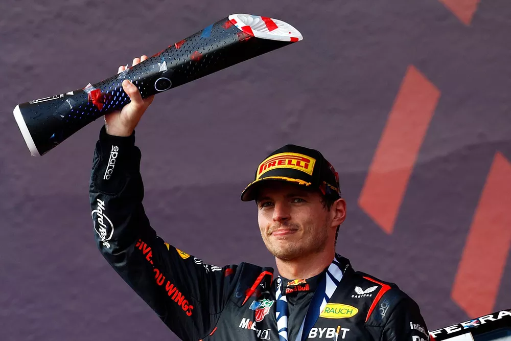 Max Verstappen, Red Bull Racing, 1st position, on the podium with his trophy