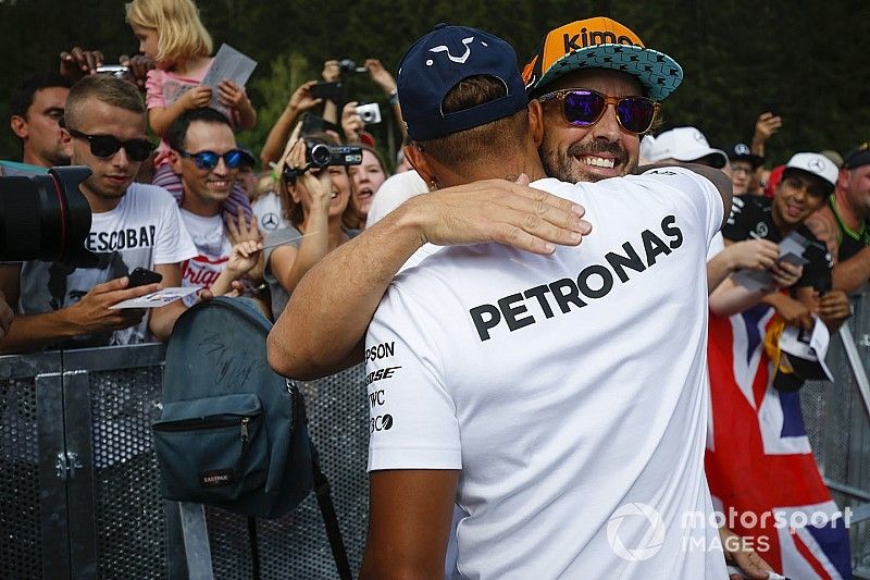 Fernando Alonso, McLaren, is greeted by Lewis Hamilton, Mercedes AMG F1