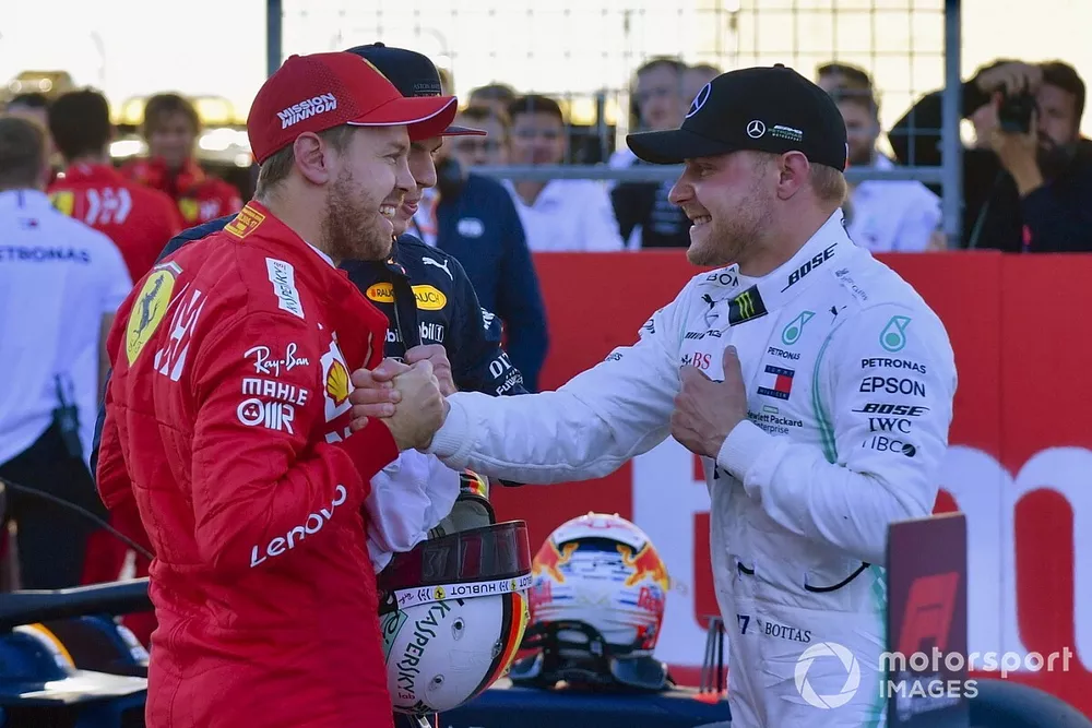 Sebastian Vettel, Ferrari, congratulates Valtteri Bottas, Mercedes AMG F1, on securing pole