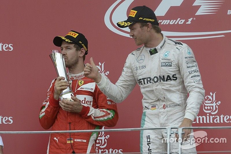 Sebastian Vettel, Ferrari y Nico Rosberg, Mercedes AMG F1