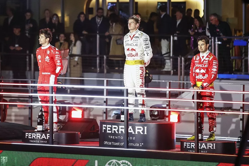 Charles Leclerc, Scuderia Ferrari, 2nd position, Max Verstappen, Red Bull Racing, 1st position, Sergio Perez, Red Bull Racing, 3rd position, on the podium