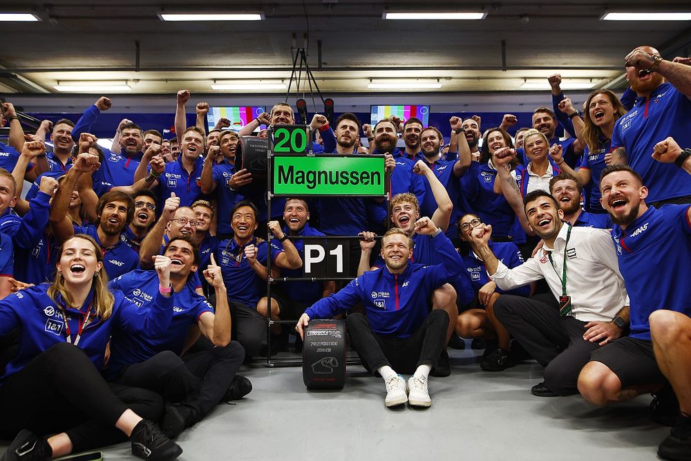 Kevin Magnussen, Haas F1 Team, and the Haas F1 team celebrate after securing pole