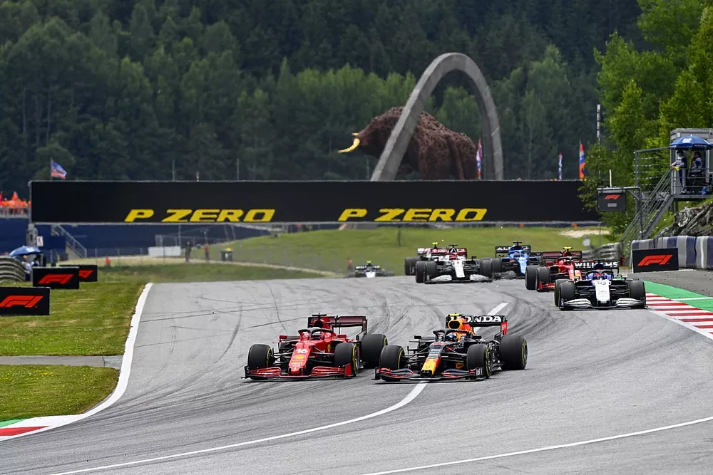 Sergio Perez, Red Bull Racing RB16B, battles with Charles Leclerc, Ferrari SF21
