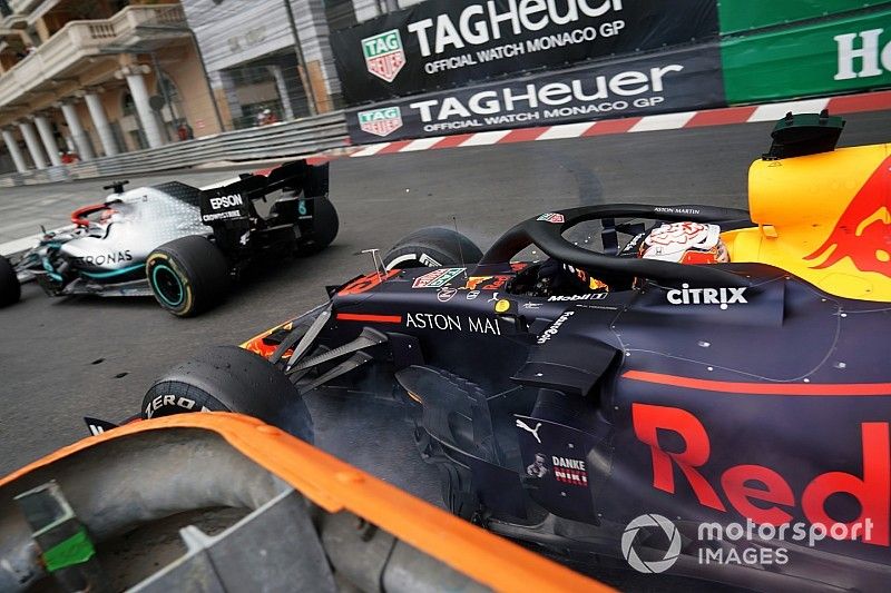 Max Verstappen, Red Bull Racing RB15, makes contact with leader Lewis Hamilton, Mercedes AMG F1 W10, in the closing stages of the race