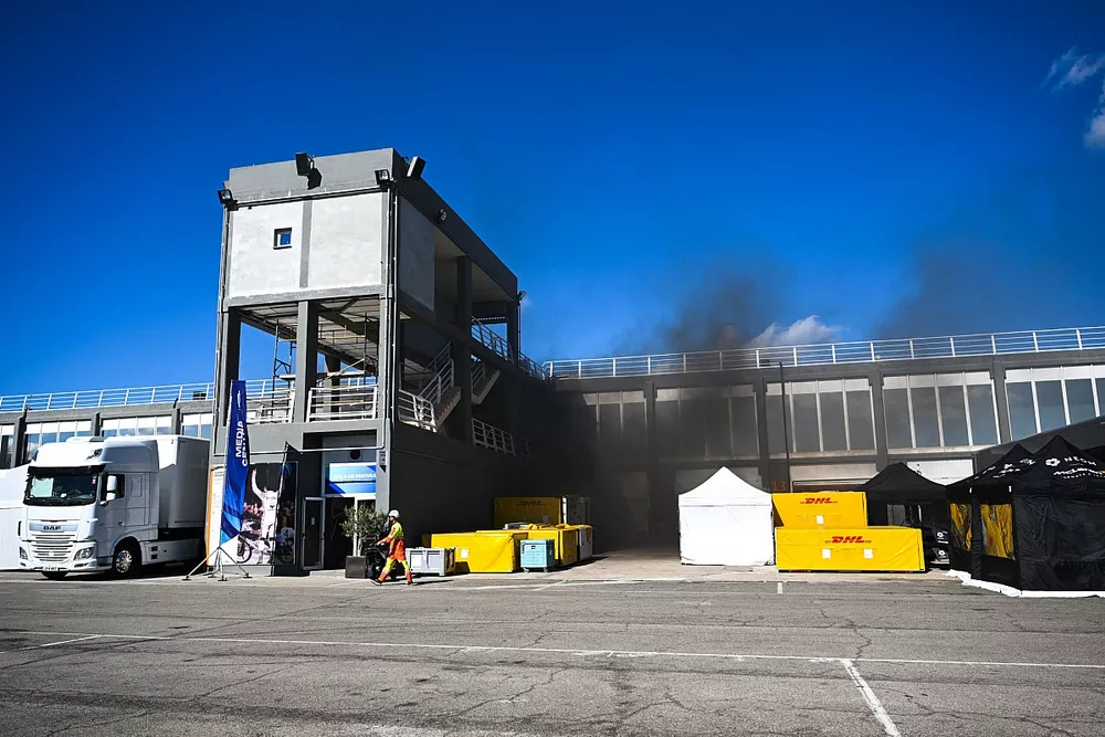 Smoke from the pit lane