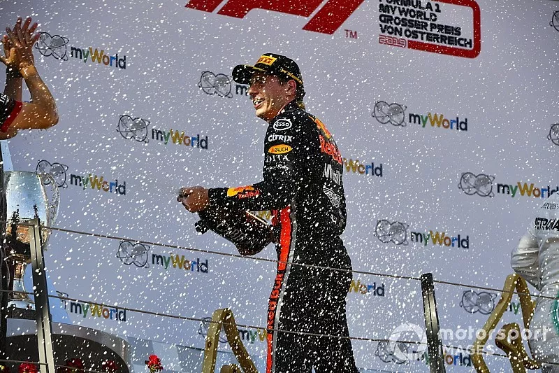 Race winner Max Verstappen, Red Bull Racing on the podium with the champagne