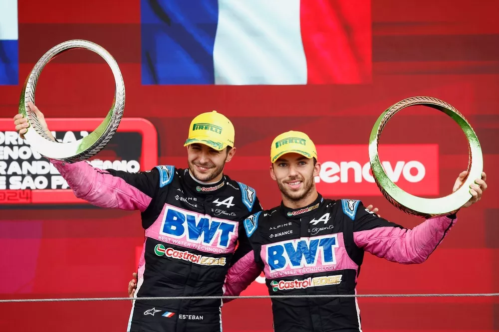 Esteban Ocon, Alpine F1 Team, 2nd position, Pierre Gasly, Alpine F1 Team, 3rd position, lift the trophy in celebration 