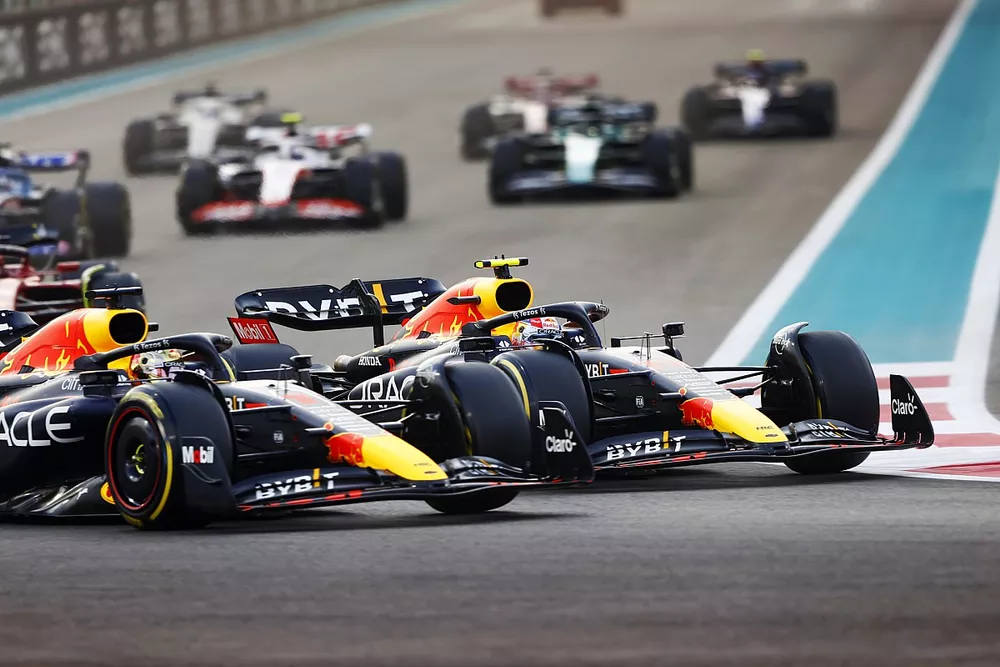 Max Verstappen, Red Bull Racing RB18, battles with Sergio Perez, Red Bull Racing RB18, at the start