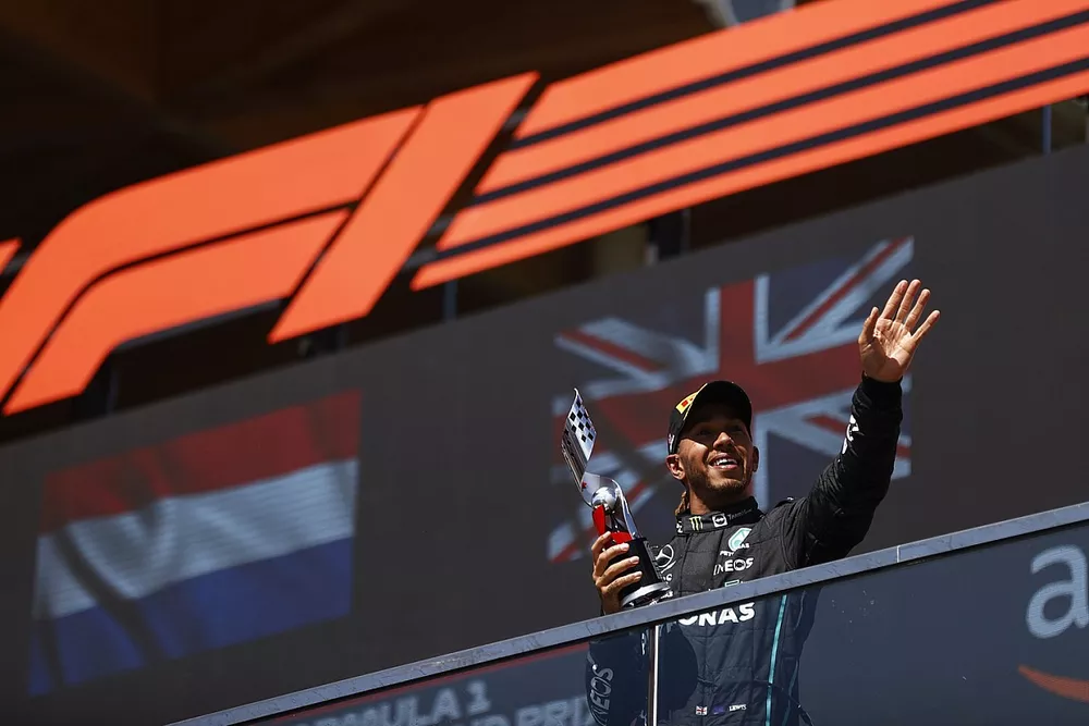 Lewis Hamilton, Mercedes-AMG, 3rd position, on the podium with his trophy