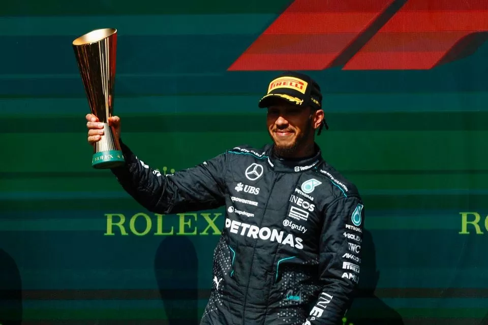 Lewis Hamilton, Mercedes-AMG F1 Team, 2nd position, holds the trophy aloft