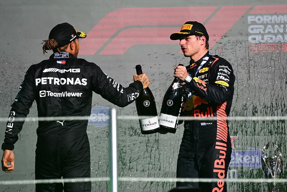 Lewis Hamilton, Mercedes-AMG, 2nd position, Max Verstappen, Red Bull Racing, 1st position, celebrate with Champagne on the podium