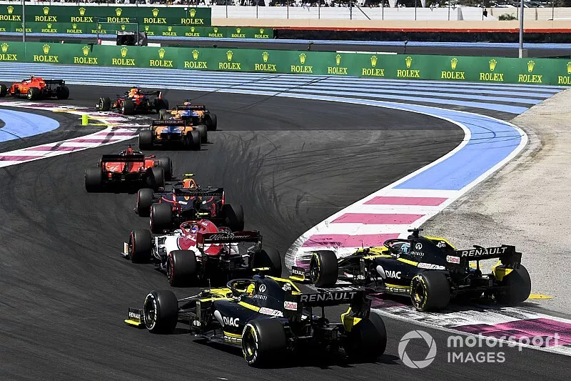 Charles Leclerc, Ferrari SF90, leads Max Verstappen, Red Bull Racing RB15, Carlos Sainz Jr., McLaren MCL34, Lando Norris, McLaren MCL34, Sebastian Vettel, Ferrari SF90, Pierre Gasly, Red Bull Racing RB15, Antonio Giovinazzi, Alfa Romeo Racing C38, Daniel Ricciardo, Renault F1 Team R.S.19, and Nico Hulkenberg, Renault F1 Team R.S. 19, on the opening lap