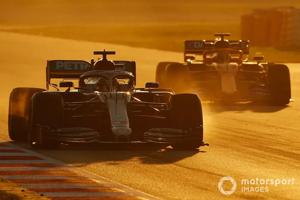 Lewis Hamilton, Mercedes F1 W11 EQ Power+, leads Carlos Sainz, McLaren MCL35 