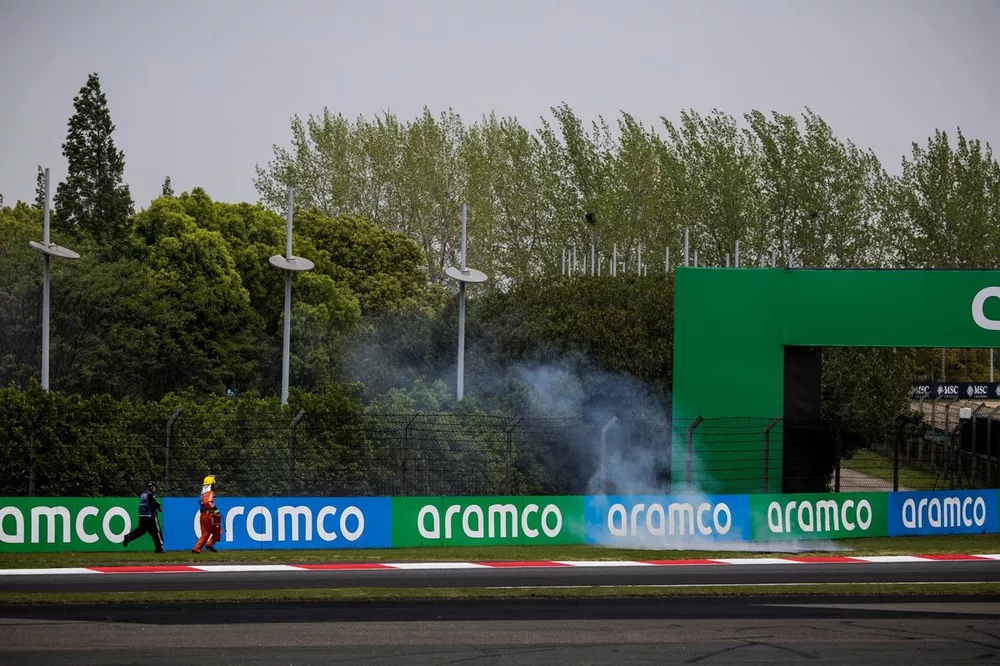 Marshals rush to put out the fire on the grass