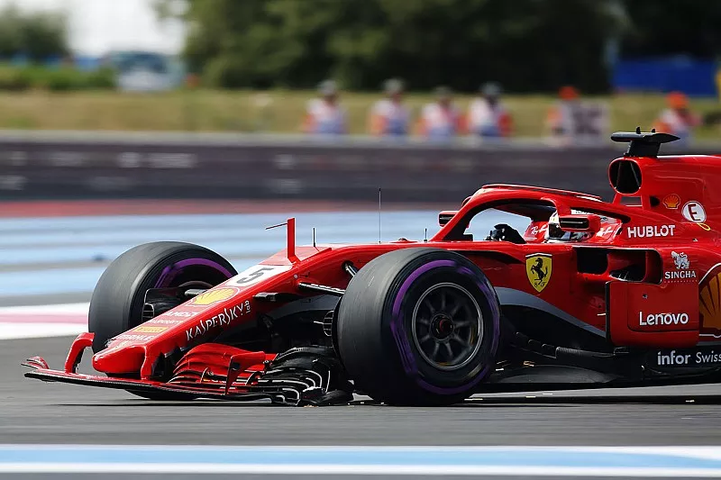 Sebastian Vettel, Ferrari SF71H, returns to the pits with a broken front wing