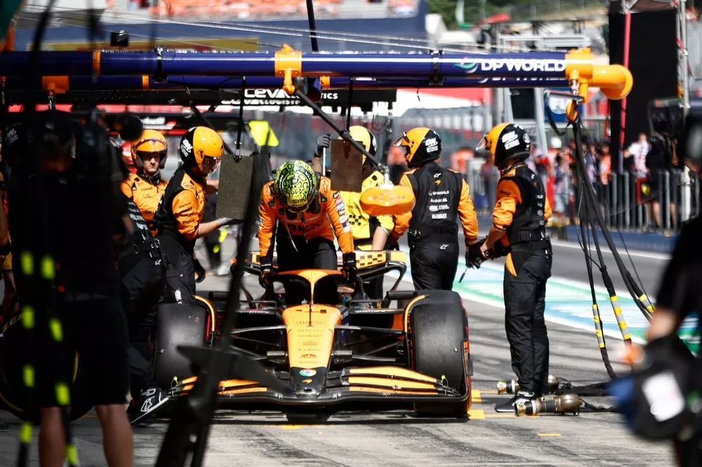 Lando Norris, McLaren MCL38, retires in the pit lane after contact with Max Verstappen, Red Bull Racing RB20, whilst battling for the lead