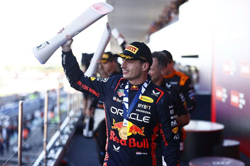 Max Verstappen, Red Bull Racing, 1st position, leaves the podium with his trophy 