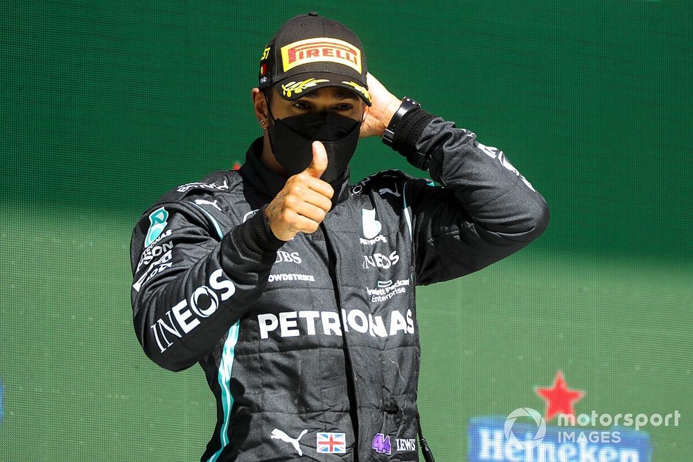Lewis Hamilton, Mercedes, 1st position, gives a thumbs up on the podium