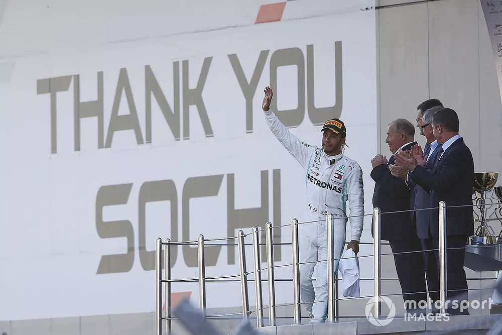 Race winner Lewis Hamilton, Mercedes AMG F1 throws his trophy in the air on the podium