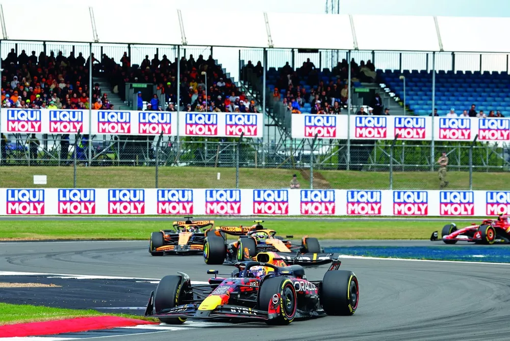 Max Verstappen, Red Bull Racing RB20, leads Lando Norris, McLaren MCL38, and Oscar Piastri, McLaren MCL38