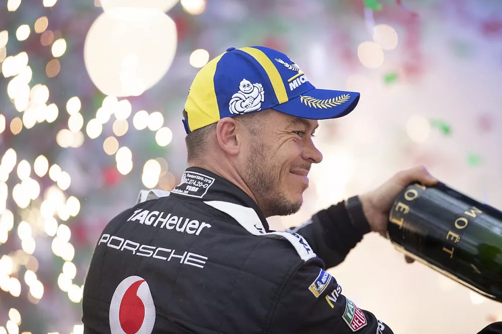 Andre Lotterer, Porsche, 2nd position, sprays Champagne on the podium