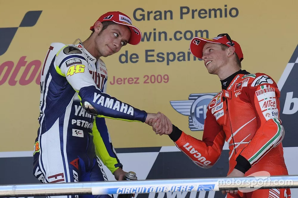 Podium: race winner Valentino Rossi, Fiat Yamaha Team, third place Casey Stoner, Ducati Marlboro Tea