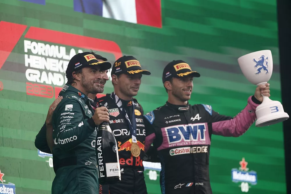 Fernando Alonso, Aston Martin F1 Team, 2nd position, the Red Bull trophy delegate, Max Verstappen, Red Bull Racing, 1st position, Pierre Gasly, Alpine F1 Team, 3rd position, on the podium