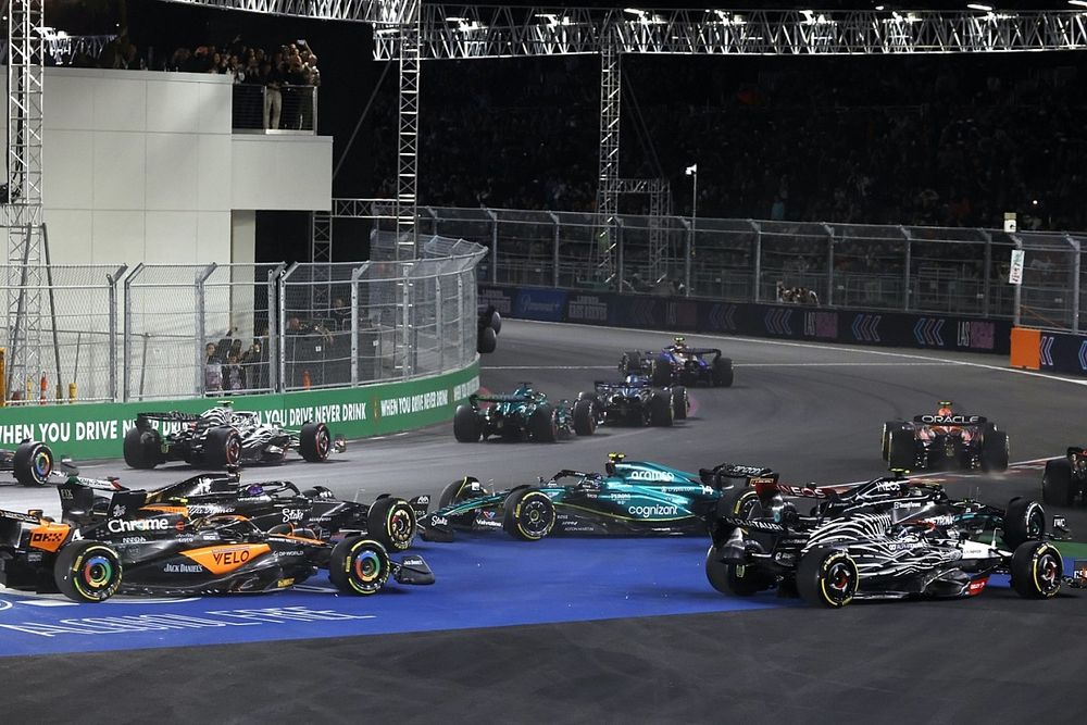 Logan Sargeant, Williams FW45, Esteban Ocon, Alpine A523, Lance Stroll, Aston Martin AMR23, Sergio Perez, Red Bull Racing RB19, as Fernando Alonso, Aston Martin AMR23, spins at the start