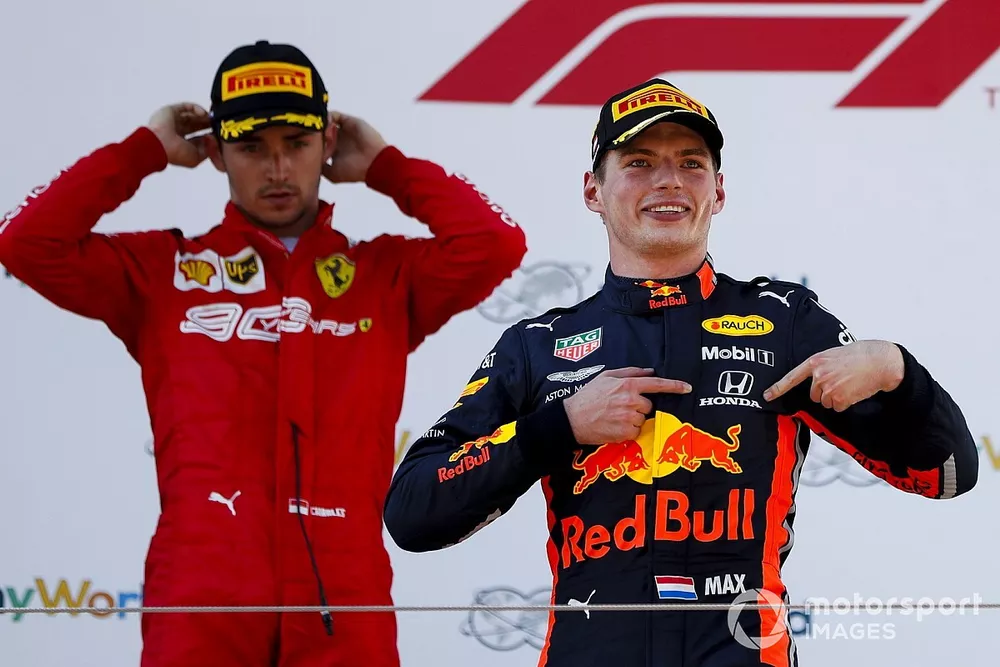 Race winner Max Verstappen, Red Bull Racing celebrates on the podium with Charles Leclerc, Ferrari