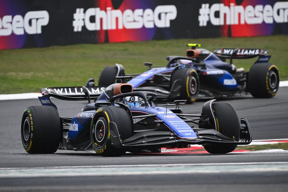 Alex Albon, Williams FW46, leads Logan Sargeant, Williams FW46