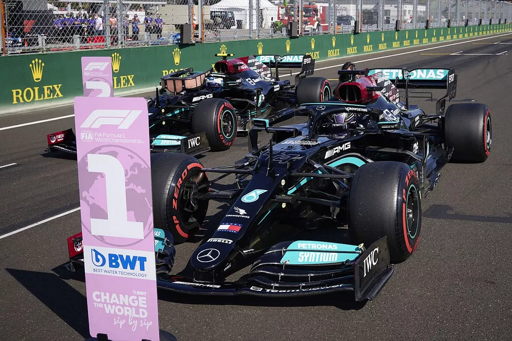 Pole man Lewis Hamilton, Mercedes W12, and Valtteri Bottas, Mercedes W12, arrive in Parc Ferme