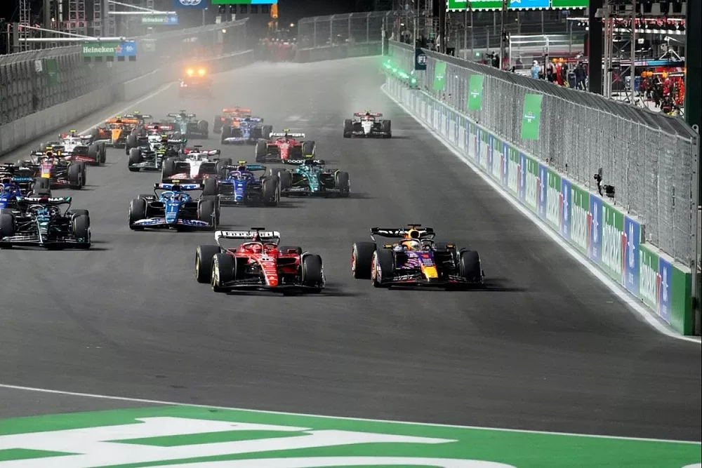 Charles Leclerc, Ferrari SF-23, battles with Max Verstappen, Red Bull Racing RB19, ahead of George Russell, Mercedes F1 W14, Pierre Gasly, Alpine A523, Alex Albon, Williams FW45, Logan Sargeant, Williams FW45, the rest of the field at the start