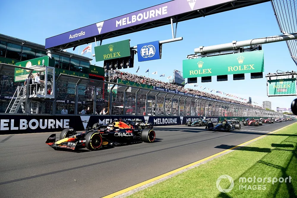 Max Verstappen, Red Bull Racing RB19, leads George Russell, Mercedes F1 W14, Sir Lewis Hamilton, Mercedes F1 W14, and the rest of the field at the start