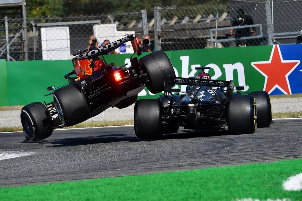 Max Verstappen, Red Bull Racing RB16B, and Lewis Hamilton, Mercedes W12, crash out