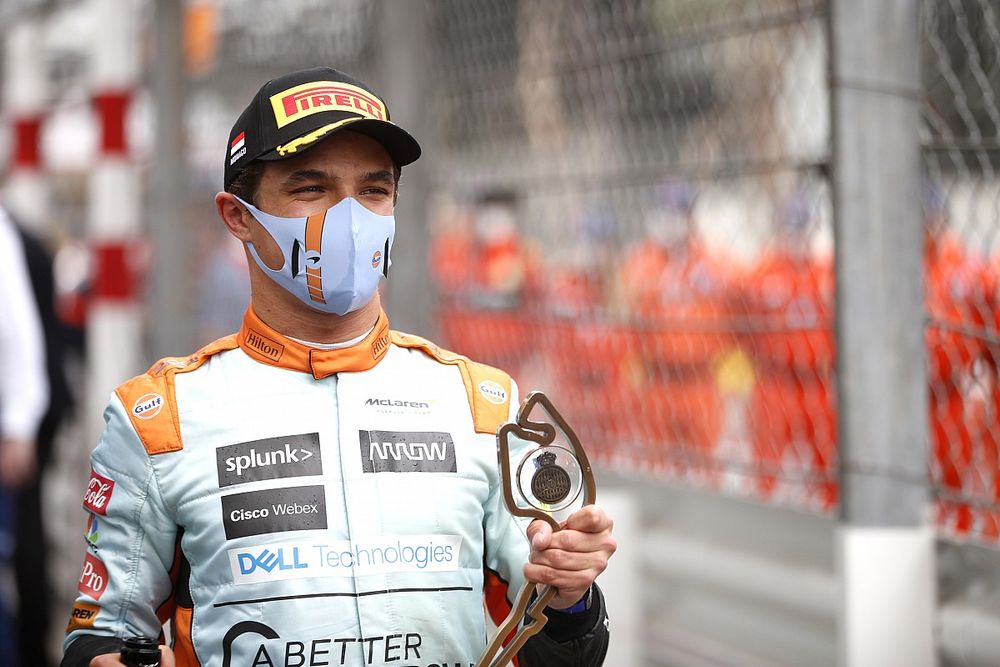 Lando Norris, McLaren, 3rd position, with his trophy and Champagne