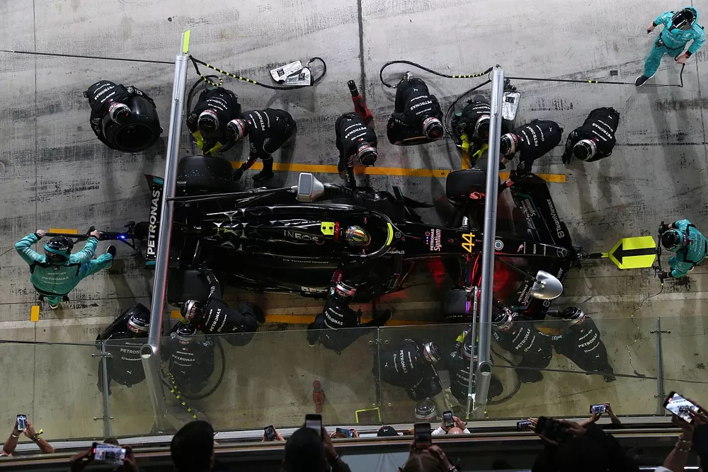 The Mercedes-AMG Team perform a pit stop on the car of Lewis Hamilton, Mercedes F1 W14 