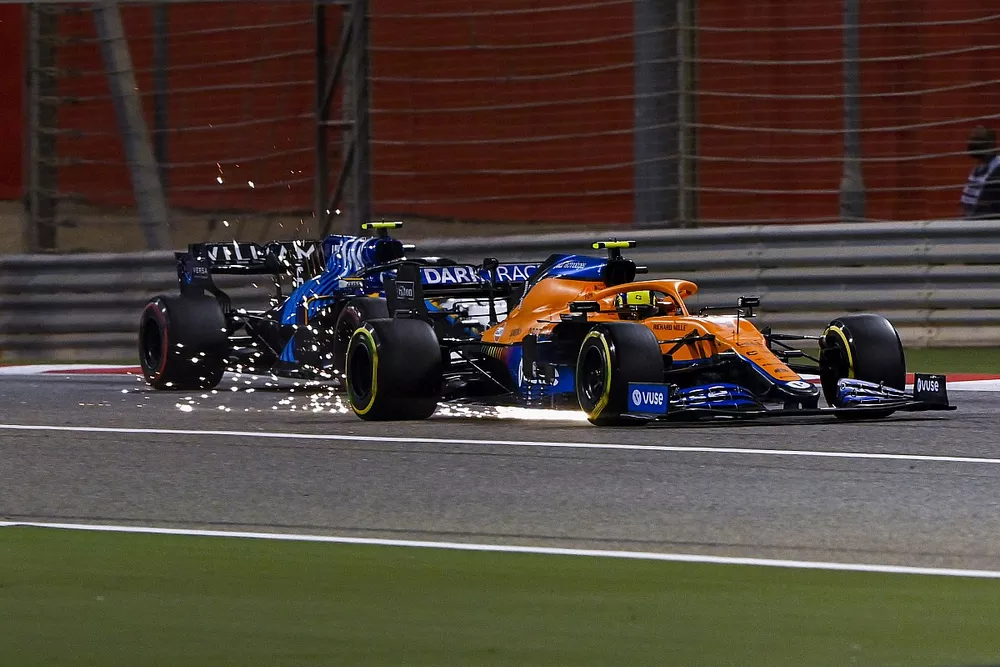 Lando Norris, McLaren MCL35M, Nicholas Latifi, Williams FW43B, as sparks fly