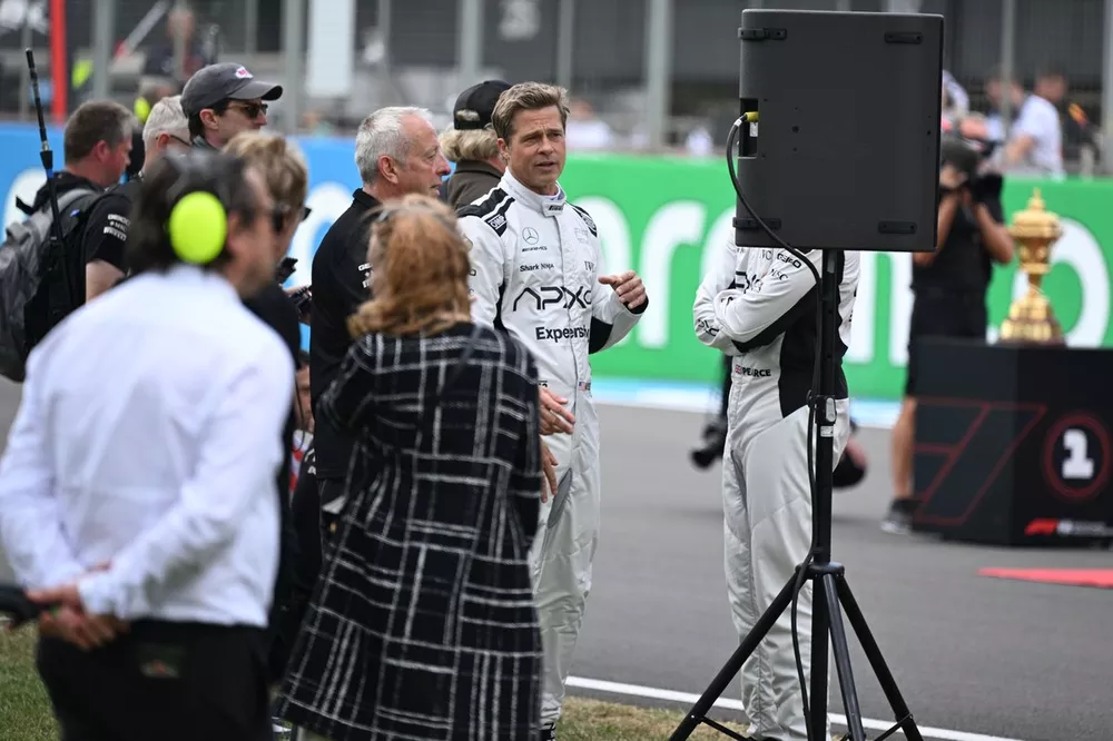 Actor Brad Pitt filming a scene for his upcoming movie featuring the fictional Apex racing team