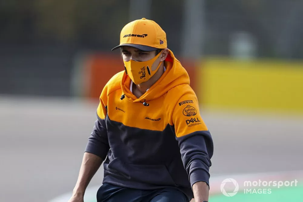 Lando Norris, McLaren, cycles around the track