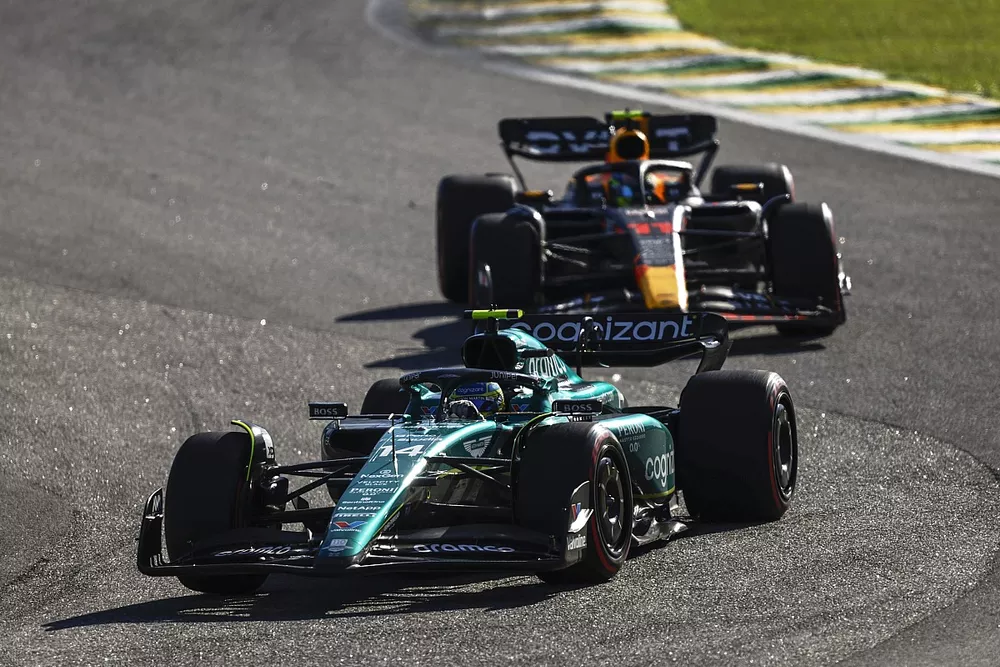 Fernando Alonso, Aston Martin AMR23, leads Sergio Perez, Red Bull Racing RB19