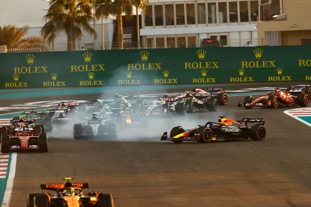 Lando Norris, McLaren MCL38, as Max Verstappen, Red Bull Racing RB20, spins after contact at the start