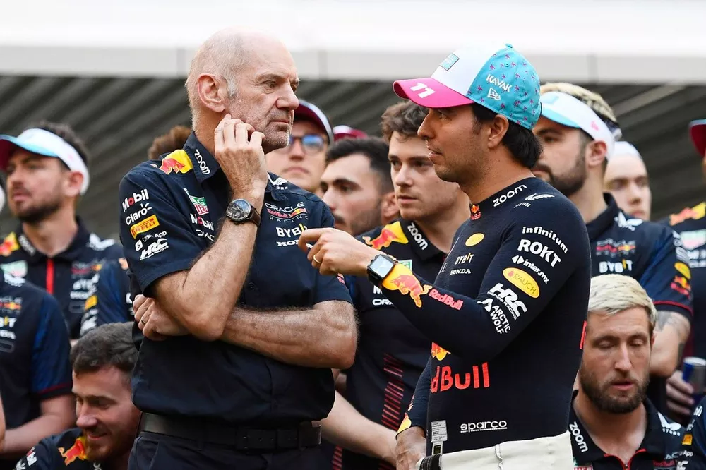 Adrian Newey, the Chief Technical Officer of Red Bull Racing speaks with second place Sergio Perez, Bull Racing