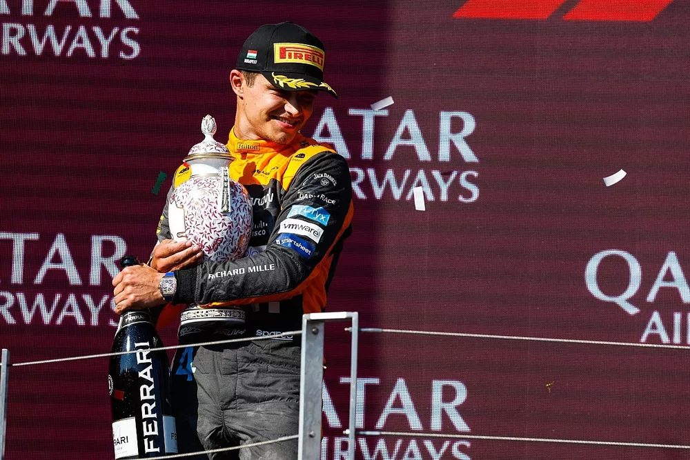 Lando Norris, McLaren, 2nd position, with his trophy and Champagne