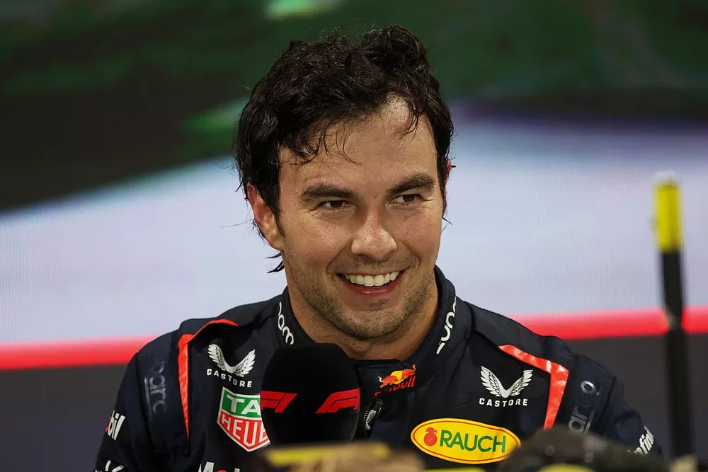 Sergio Perez, Red Bull Racing, 1st position, is interviewed by David Coulthard in Parc Ferme